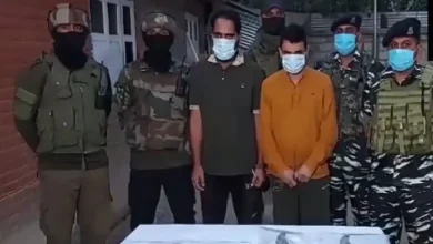 Indian security forces personnel arrest five hybrid terrorists after busting two terror modules in Kulgam