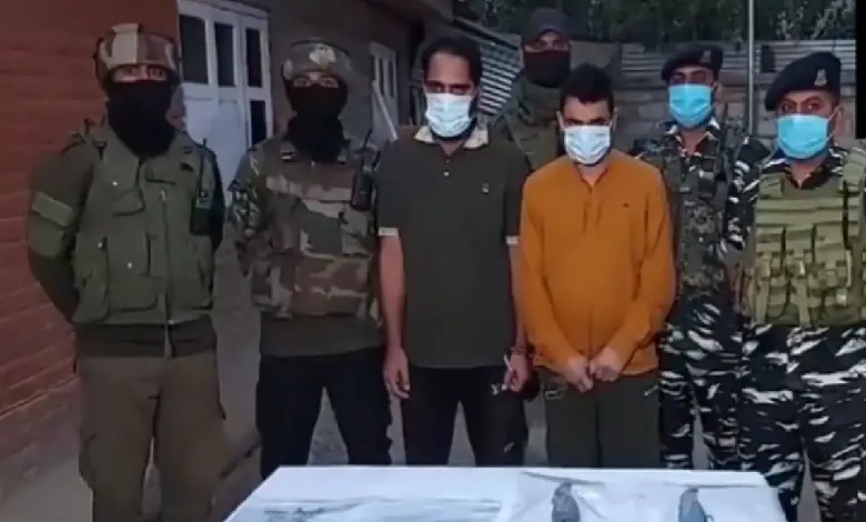 Indian security forces personnel arrest five hybrid terrorists after busting two terror modules in Kulgam