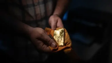 Gold bars representing the surge in value due to safe-haven demand following the Gaza hospital strike