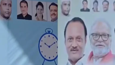 Ajit Pawar standing in front of banners with photos of Yashwantrao Chavan and Sharad Pawar