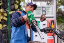 A fuel pump with petrol and diesel prices displayed on the board