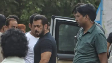 Salman Khan surrounded by police officers