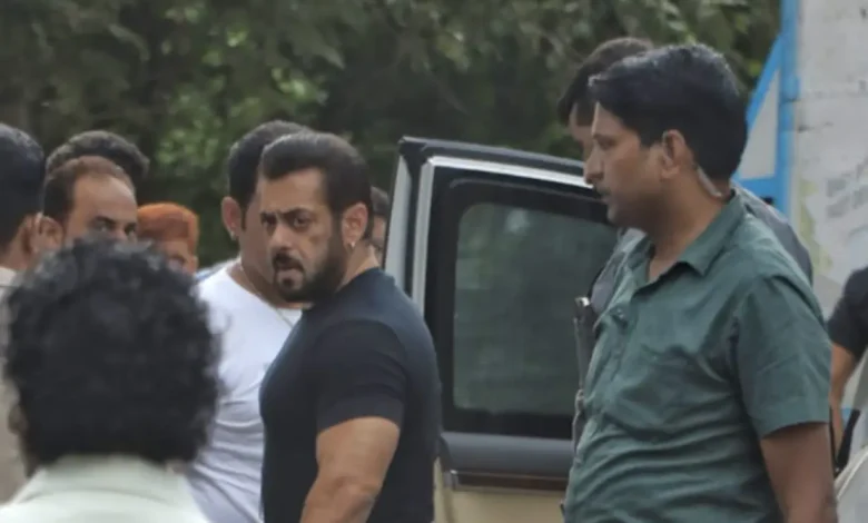 Salman Khan surrounded by police officers
