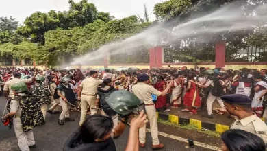 Security personnel use water cannon to disperse Anganwadi workers protesting outside the Bihar Legislative Assembly in Patna