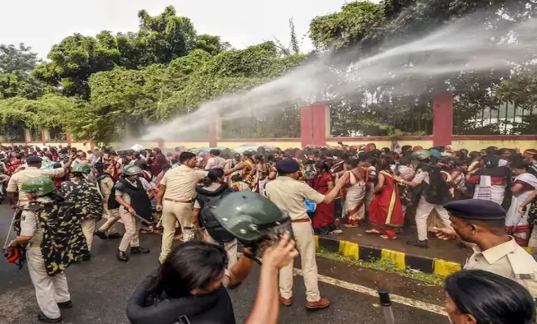 Security personnel use water cannon to disperse Anganwadi workers protesting outside the Bihar Legislative Assembly in Patna