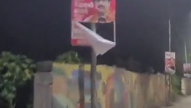 A torn banner of Uddhav Thackeray in Thane.
