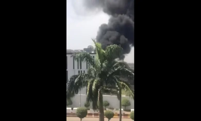 In a screenshot taken from a video, plumes of smoke are shown coming from inside the compound of the High Commission of Canada in Abuja, Nigeria, on Monday