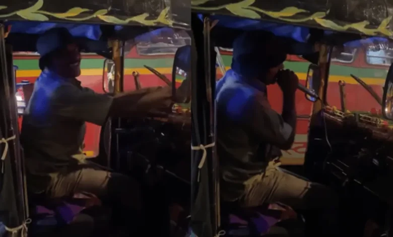 A rickshaw puller passionately singing a song while pulling his rickshaw.