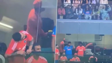 Virat Kohli is caught on camera trying to catch a glimpse of his wife Anushka Sharma from the dressing room during a cricket match
