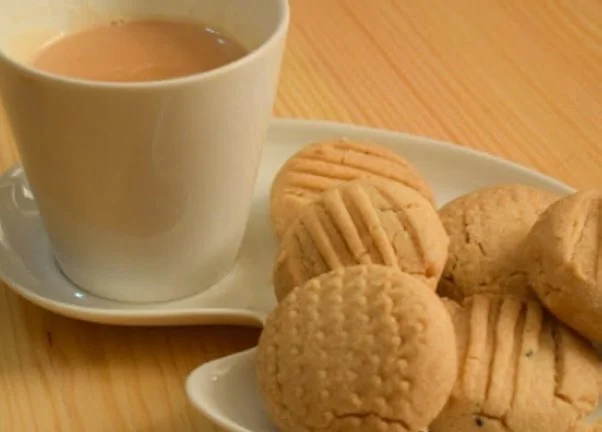 A doctor is prescribing tea-biscuits for a patient.