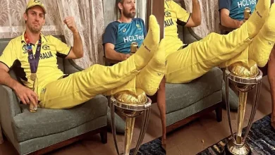 Mitchell Marsh with his feet on the World Cup trophy
