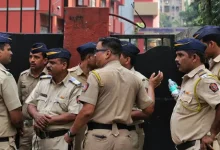 Mumbai Police officers investigating a threatening call in the control room