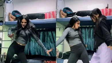 wo young women dancing energetically to a Bhojpuri song in a crowded, moving train compartment, sparking mixed reactions online