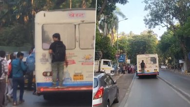 A student hangs precariously from the back of a moving bus, captured in a viral video.