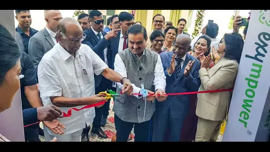 Sharad Pawar and Gautam Adani shaking hands, symbolizing political-business alliance in Maharashtra.