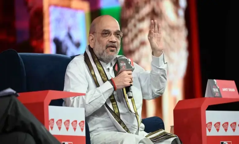 Amit Shah addressing a crowd, emphasizing PM Modi's vision for self-reliant India.