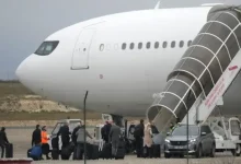 Crew members board the plane grounded by police at the Vatry airport on Monday. The plane landed in Mumbai shortly after 4 am on Tuesday