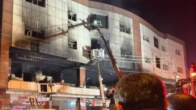 Firefighters undertake a rescue operation after the Soran University fire