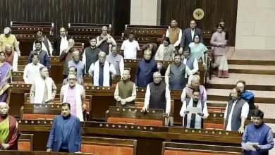 Members of Parliament standing in the Rajya Sabha during the Winter Session.
