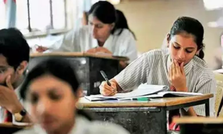 Students writing exams in separate phases as per new Gujarat board rules.
