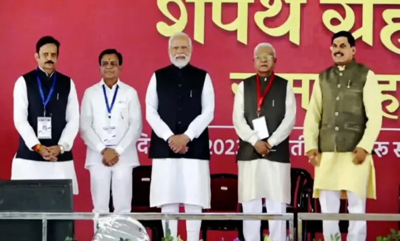 Prime Minister Narendra Modi with the newly sworn-in Madhya Pradesh Chief Minister Mohan Yadav (far right) and others during the oath ceremony, in Bhopal, on December 13, 2023