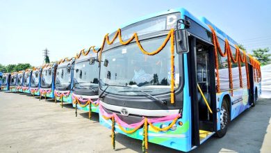 Electric buses zipping through Delhi's streets, symbolizing a cleaner future for the city. CNG-diesel buses also play a role in tackling air pollution.