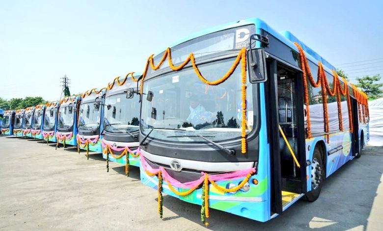 Electric buses zipping through Delhi's streets, symbolizing a cleaner future for the city. CNG-diesel buses also play a role in tackling air pollution.