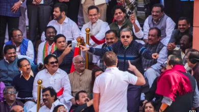 TMC MP Kalyan Banerjee mimicking Vice President Jagdeep Dhankhar in Parliament, with Rahul Gandhi holding the camera.