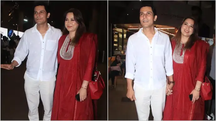 Randeep Hooda and his wife smiling and holding hands while walking through the airport after their marriage.