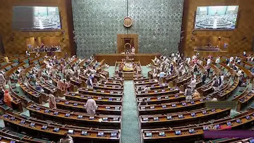 Three Indian MPs gesturing angrily during Lok Sabha suspension proceedings.