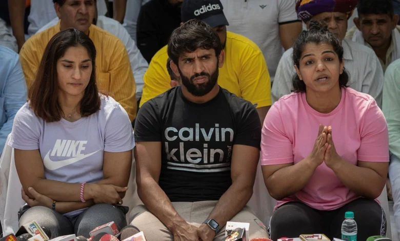 Junior wrestlers hold placards during their protest at Jantarmantar, accusing senior wrestlers of sabotaging their careers.