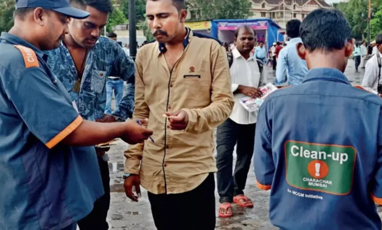 Clean-up marshal officer patrolling a busy Mumbai street.