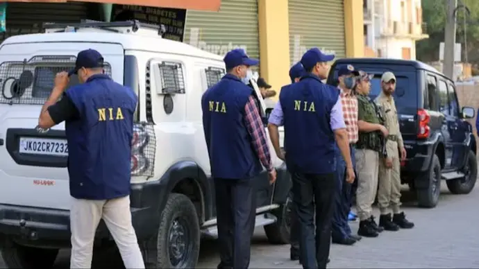 NIA officials during the arrest of suspected ISIS operatives in Maharashtra.