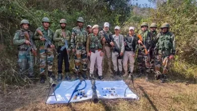Assam Rifles and Manipur Police personnel with seized arms and ammunition at Sabungkhok Khunao Chanung ridge, in Imphal East district