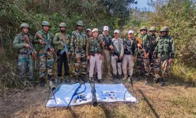 Assam Rifles and Manipur Police personnel with seized arms and ammunition at Sabungkhok Khunao Chanung ridge, in Imphal East district