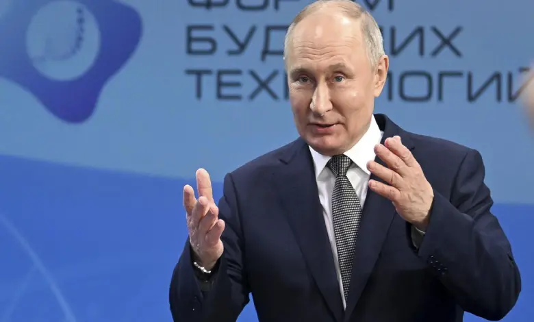 Russian President Vladimir Putin gestures as he speaks to scientists on the sidelines of the Future Technologies Forum at the World Trade Centre in Moscow, Russia