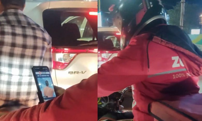 Zomato delivery boy seen studying UPSC on bike in heavy traffic