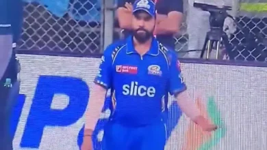 Rohit Sharma gesturing to the crowd for silence