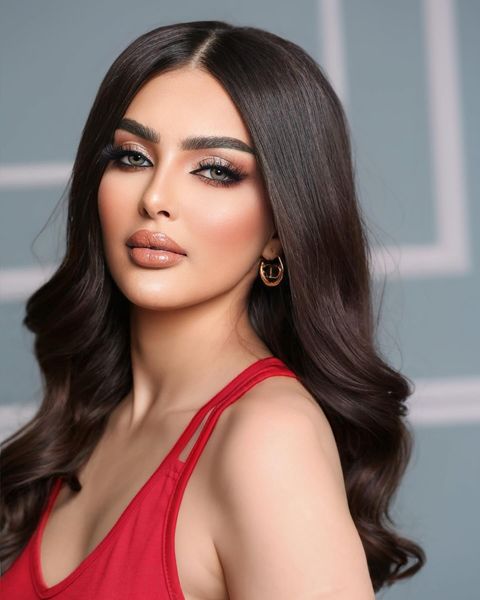 Rumi Alqahtani and Miss Universe logo with a ‘truth revealed’ sign in Gujarati