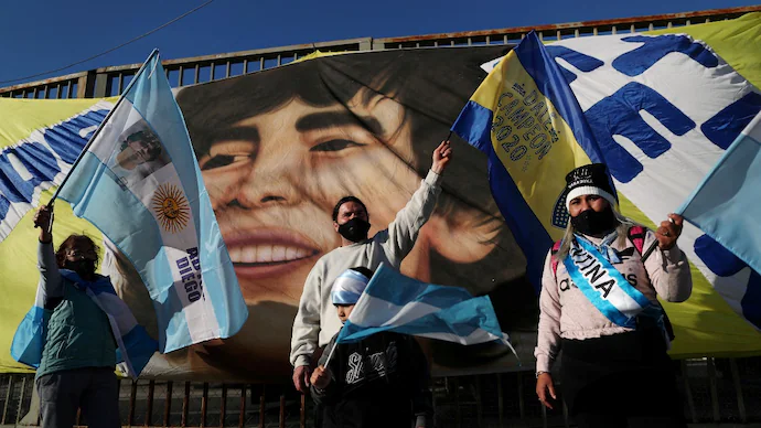 Where did Maradona's children demand their father's body be transferred from the cemetery?