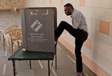 A disabled youth casts vote using foot and inspired other voters to vote