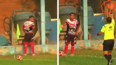 The referee showed the red card because the footballer stood up to urinate!