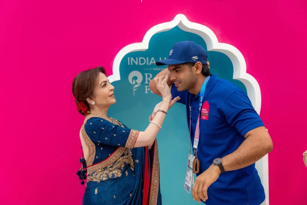 Nita Ambani looks in blue saree and amboda with rose...