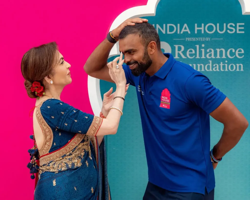 Nita Ambani looks in blue saree and amboda with rose...