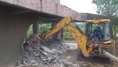 Bulldozer roams over Vishwamitri river in Vadodara