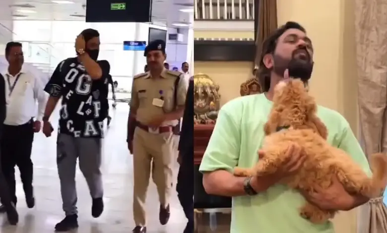 Dhoni returns from USA, plays with dog