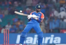 Hardik Pandya holding the bat with which he hit the no-look shot during a cricket match