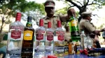 "image of police personnel in ahmedabad facing legal action for alcohol consumption"