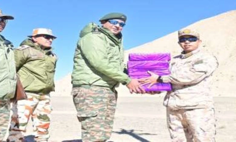  Indian and Chinese armies greet each   other, administer  sweets