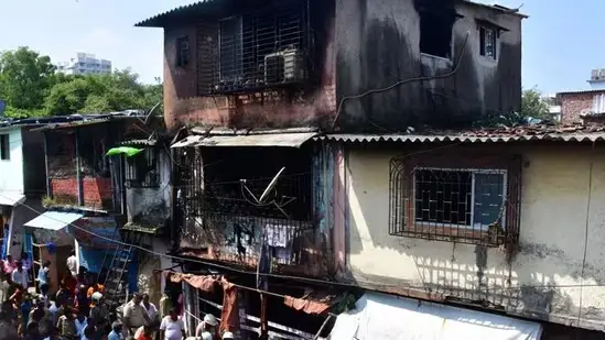 "Aftermath of devastating occurrence  successful  Mumbai slum, demolition  and debris"